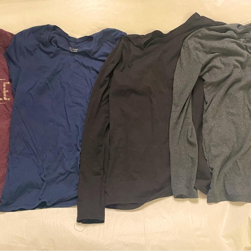 4 used shirts 2 long sleeves and 2 short sleeves size XL and L